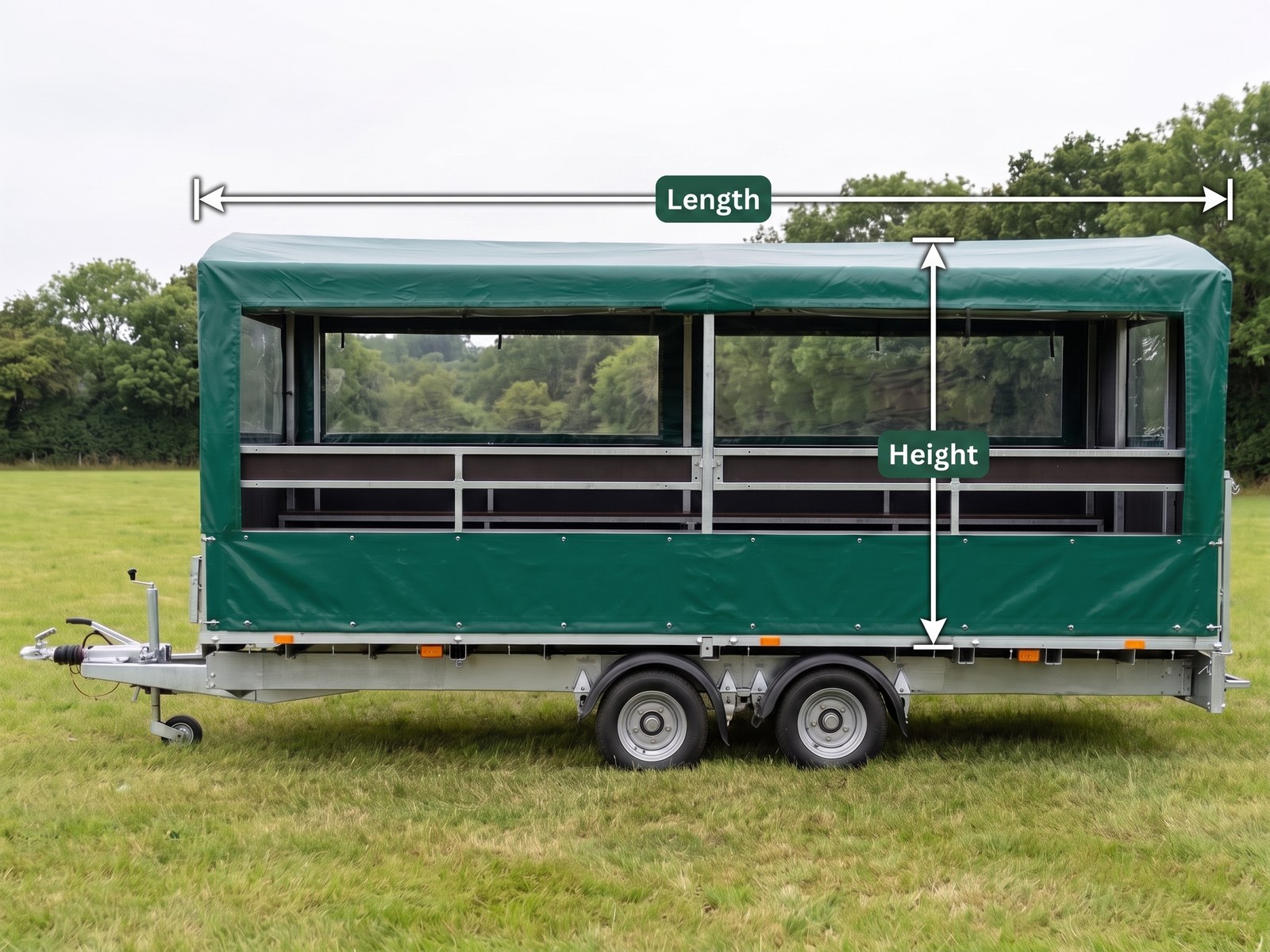 A gun bus trailer with a green PVC cover over its steel frame, marked with a Length dimension along the body and a Height dimension from the roof to the chassis