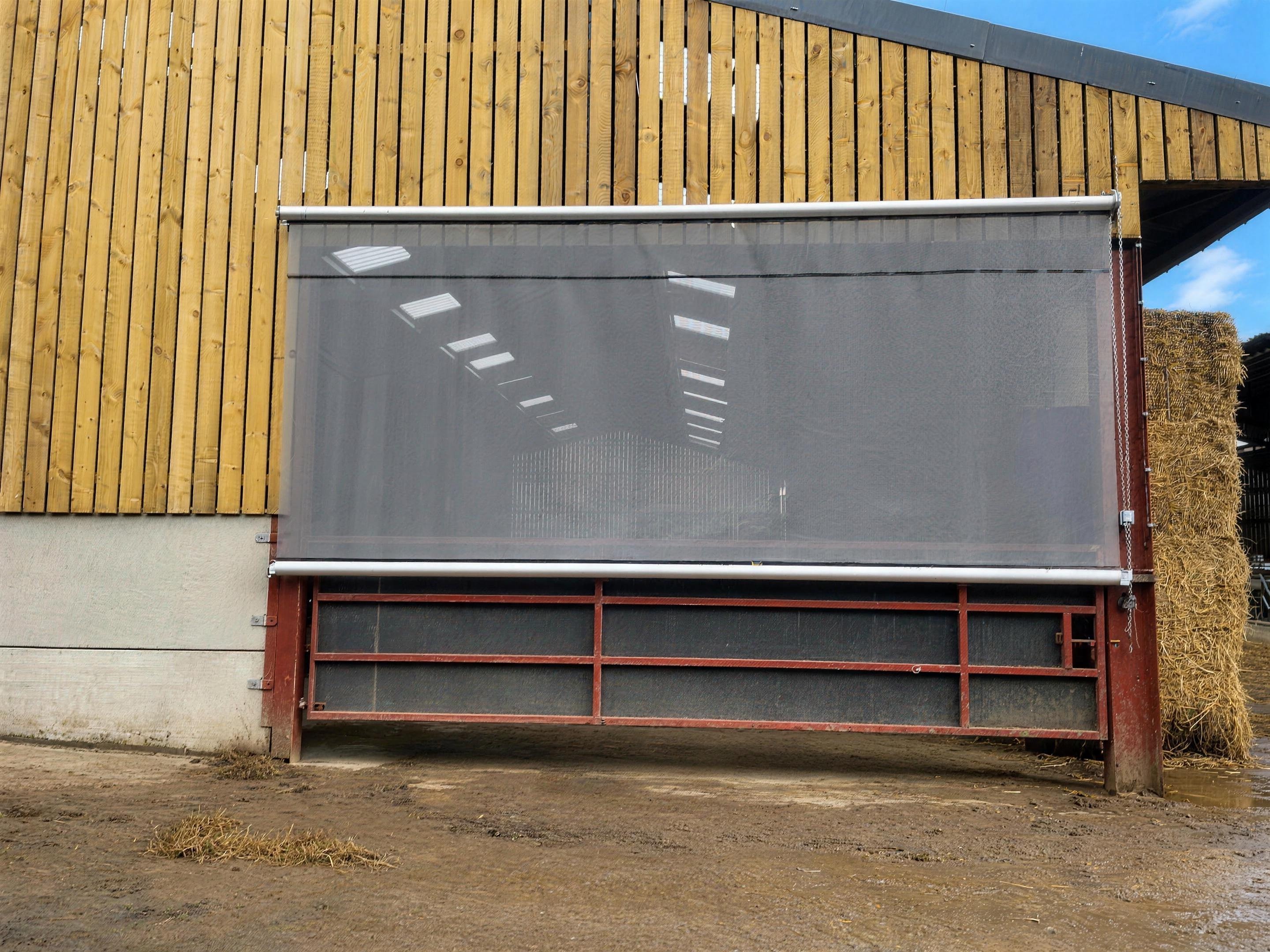 Hand chain roller blind on a farm building