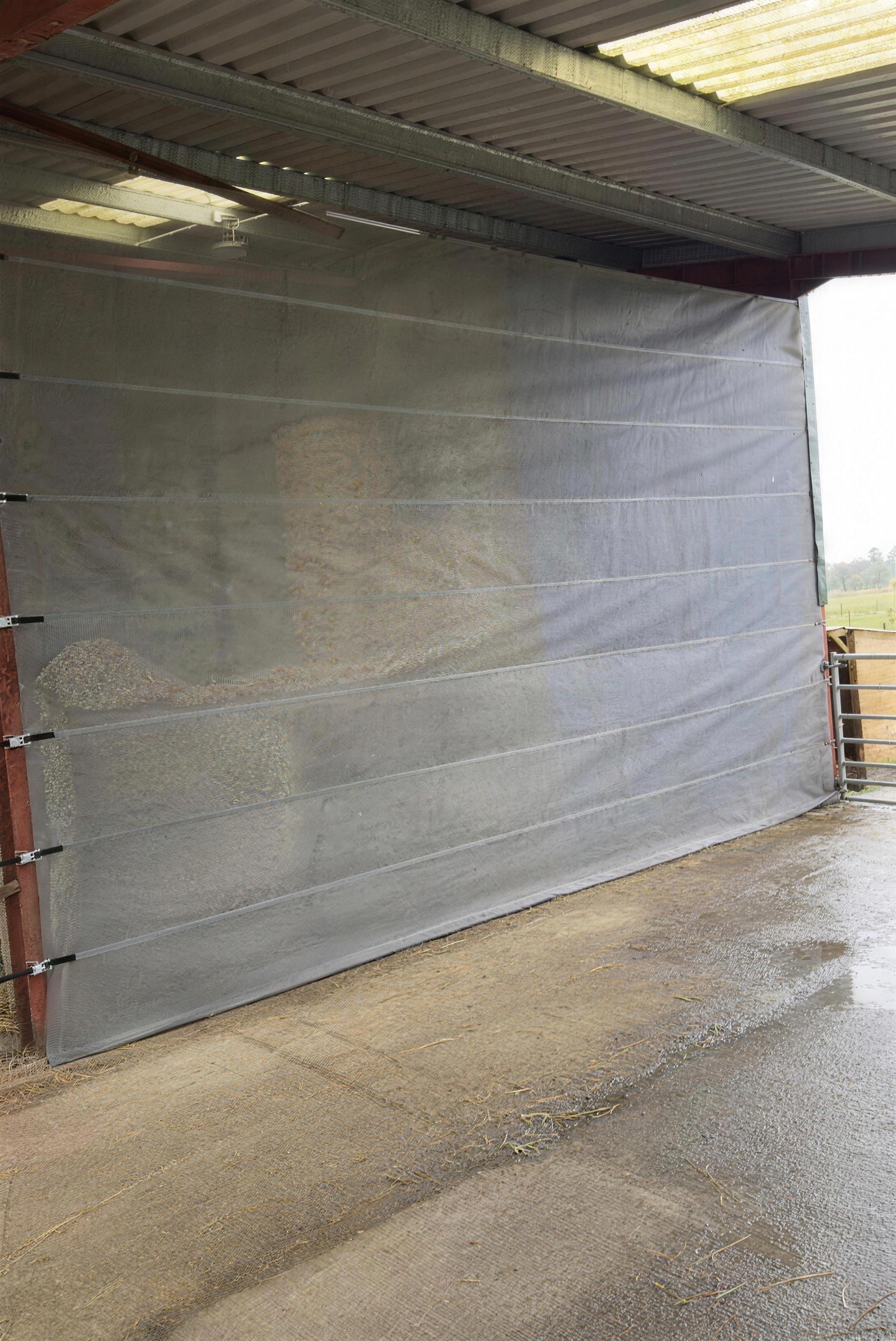 Windbreak fitted to a livestock building