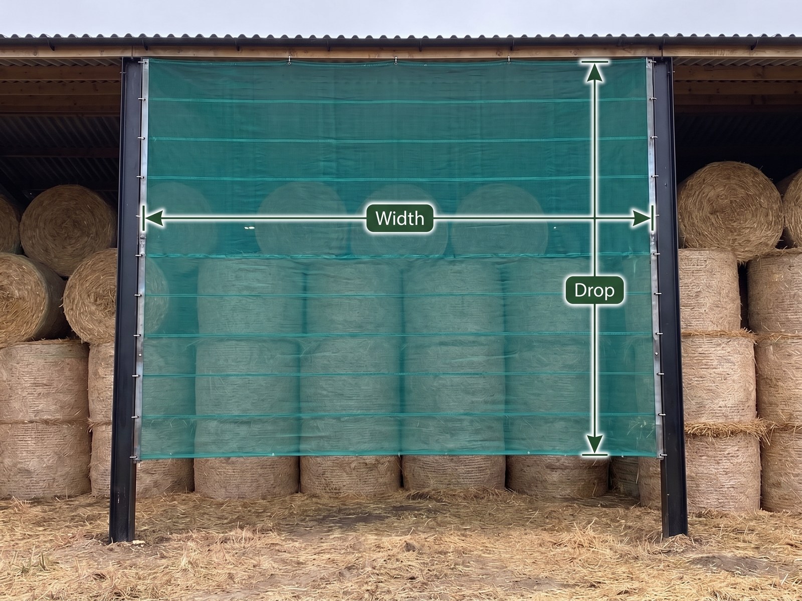 A coated PVC mesh windbreak in a farm building opening, marked with a Width dimension across the opening and a Drop dimension down the mesh