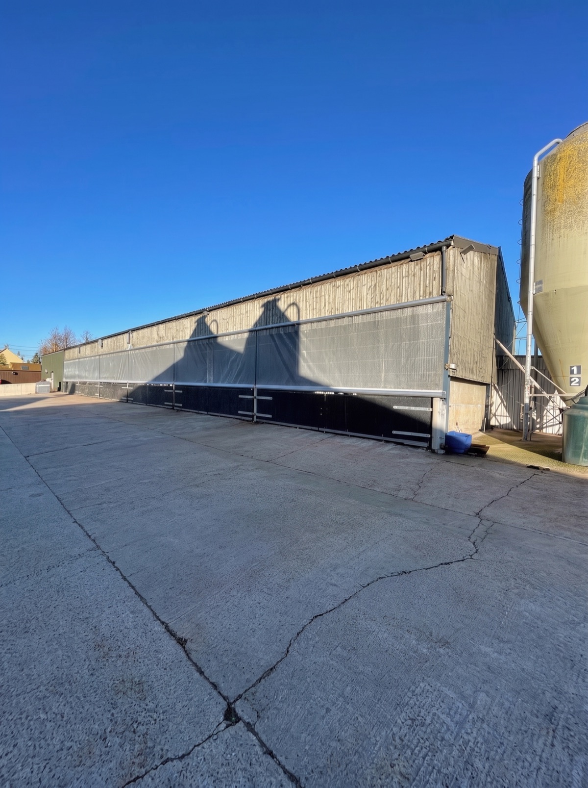 Roller blinds along the elevation of an industrial building