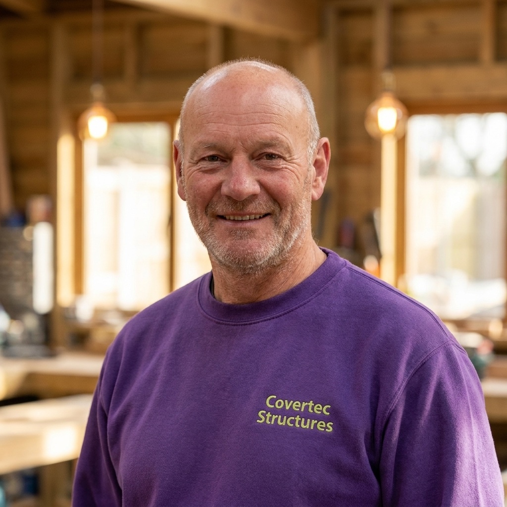 A smiling member of the Covertec team in the production site